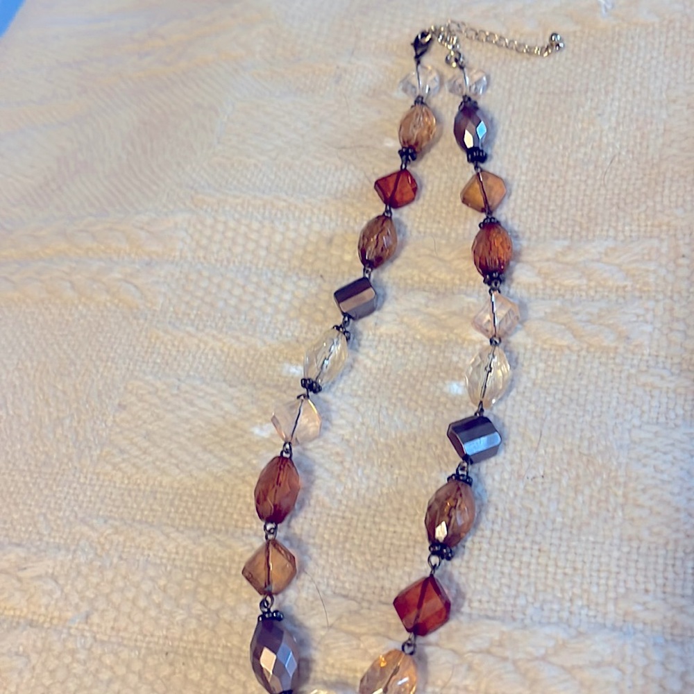 Amber and silver beaded necklace, 9 inches long.